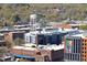 Aerial view of buildings featuring a water tower, brick buildings, and lush trees at 110 N Corcoran St # 2302, Durham, NC 27701