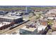 Aerial view of a cityscape with residential buildings and a passenger train traveling through the city at 110 N Corcoran St # 2302, Durham, NC 27701