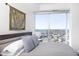 Bright bedroom features a large window with expansive city views, complementing the room's modern decor at 110 N Corcoran St # 2302, Durham, NC 27701