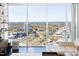 Spectacular city view through expansive windows in the living room at 110 N Corcoran St # 2302, Durham, NC 27701