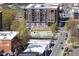 Aerial view of the cityscape showcases a mural, Central Park, and modern buildings at 110 N Corcoran St # 2302, Durham, NC 27701