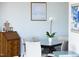 Dining room with stylish table, chairs, décor, and abundant natural light at 110 N Corcoran St # 2302, Durham, NC 27701