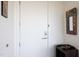 Welcoming front entrance with a white door, decorative mirror, and hall table at 110 N Corcoran St # 2302, Durham, NC 27701
