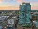 Striking high-rise exterior view, showcasing modern architecture with cityscape in the background at 110 N Corcoran St # 2302, Durham, NC 27701