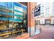 Exterior shot of a local market in a brick building, showcasing the storefront and surrounding cityscape at 110 N Corcoran St # 2302, Durham, NC 27701