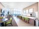 Resident kitchen area with a large counter, bar seating, and views overlooking the city at 110 N Corcoran St # 2302, Durham, NC 27701