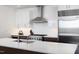 Contemporary kitchen with stainless steel appliances, island, and ample cabinet space at 110 N Corcoran St # 2302, Durham, NC 27701