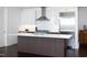 Modern kitchen featuring a large island, stainless steel appliances, and sleek white cabinets for a contemporary design at 110 N Corcoran St # 2302, Durham, NC 27701