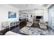 Open-concept living room with modern decor, stylish furniture, and hardwood floors at 110 N Corcoran St # 2302, Durham, NC 27701