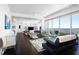 Bright, modern living space featuring open concept layout, comfortable furniture and an outdoor balcony view at 110 N Corcoran St # 2302, Durham, NC 27701