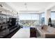 Bright living room with floor-to-ceiling windows and city views, paired with modern decor and hardwood floors at 110 N Corcoran St # 2302, Durham, NC 27701