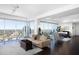 Sophisticated living room featuring hardwood floors, city views, and a modern design with stylish furniture at 110 N Corcoran St # 2302, Durham, NC 27701