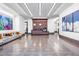 A spacious lobby area with stylish seating, modern artwork, and a welcoming reception desk at 110 N Corcoran St # 2302, Durham, NC 27701