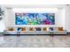 The lobby features a comfortable seating area with modern art, providing a stylish and inviting space at 110 N Corcoran St # 2302, Durham, NC 27701