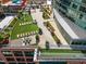 Inviting rooftop deck with lounge chairs, dining area, artificial turf, and garden area at 110 N Corcoran St # 2302, Durham, NC 27701