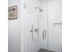 Modern glass-enclosed shower with white subway tile, chrome fixtures, and a convenient built-in niche at 110 N Corcoran St # 2302, Durham, NC 27701