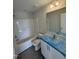 Bathroom with a combined tub and shower and vanity under construction with protective covering at 1105 Brookrun Dr, Oxford, NC 27565