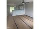 Bright open-concept living room with kitchen view, featuring sliding glass doors at 1105 Brookrun Dr, Oxford, NC 27565