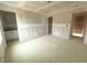 Bedroom with drywall before finishes showing layout, including bathroom entrance and closet at 1105 Brookrun Dr, Oxford, NC 27565