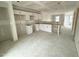 Spacious kitchen featuring white cabinets, an island, and ample room for appliances before final finishes at 1105 Brookrun Dr, Oxford, NC 27565