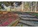 Beautiful stone path winds through the backyard garden at 111 Standing Rock Rd, Chapel Hill, NC 27516