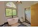 Elegant bathroom featuring a soaking tub, arched windows, and a walk-in shower at 111 Standing Rock Rd, Chapel Hill, NC 27516