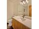 Contemporary bathroom featuring a large mirror, stylish lighting, and modern fixtures at 111 Standing Rock Rd, Chapel Hill, NC 27516