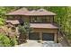 Stunning exterior view of a modern home featuring a two-car garage and pristine landscaping at 111 Standing Rock Rd, Chapel Hill, NC 27516