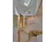 Bright hallway with skylight, carpet, and natural wood railings at 111 Standing Rock Rd, Chapel Hill, NC 27516