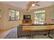 Comfortable living room with a large window overlooking greenery and a ceiling fan offering a relaxing space at 111 Standing Rock Rd, Chapel Hill, NC 27516