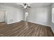 Bedroom featuring hardwood floors, multiple windows, and a ceiling fan at 117 Pierce Rd, Garner, NC 27529