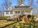 Charming home featuring a welcoming front porch with stately columns and steps leading to the main entrance at 117 Pierce Rd, Garner, NC 27529