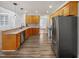 Kitchen with stainless steel appliances, long countertops, and hardwood floors at 117 Pierce Rd, Garner, NC 27529