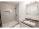 Bright bathroom with shower-tub combination, granite vanity, and tile surround at 1204 Pecan Pl, Durham, NC 27704