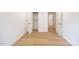 Light-filled bedroom featuring wood-look flooring and ample closet space at 1204 Pecan Pl, Durham, NC 27704