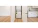 A laundry area in the kitchen with stacked washer and dryer units at 1204 Pecan Pl, Durham, NC 27704