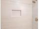 Close up of tiled shower with built in niche at 1204 Pecan Pl, Durham, NC 27704