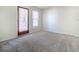 Cozy bedroom with carpet flooring, and natural light from a window and door at 121 Westview Dr # 43, Carrboro, NC 27510