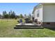 Backyard deck with outdoor seating and grill perfect for entertaining at 122 Blueberry Dr, Selma, NC 27576