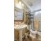 Bathroom with a pedestal sink, decorative mirror, toilet, and shower at 122 Blueberry Dr, Selma, NC 27576