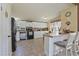Kitchen with updated appliances, breakfast bar, eat-in kitchen and white cabinetry at 122 Blueberry Dr, Selma, NC 27576