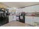 Well-equipped kitchen features updated appliances, ample counter space and white cabinetry at 122 Blueberry Dr, Selma, NC 27576