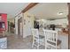 Open kitchen featuring a breakfast bar with white cabinets and flooring at 122 Blueberry Dr, Selma, NC 27576