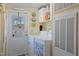 Functional laundry area with washer, dryer, natural light and additional storage at 122 Blueberry Dr, Selma, NC 27576
