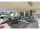 Inviting porch features comfortable seating, a ceiling fan, and a 'Welcome Home' sign at 122 Blueberry Dr, Selma, NC 27576