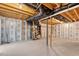 Unfinished basement with concrete floors and exposed ceiling, offering customization potential at 1423 Bridgewater Dr, Durham, NC 27704
