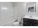 Well-lit bathroom featuring a shower-tub combination and sleek vanity with a sink at 1423 Bridgewater Dr, Durham, NC 27704
