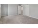 Spacious bedroom with plush carpeting, natural light and multiple doors for closet and access at 1423 Bridgewater Dr, Durham, NC 27704