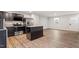 Modern kitchen features stainless steel appliances, an island and an open floorplan at 1423 Bridgewater Dr, Durham, NC 27704