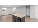 Spacious modern kitchen featuring an island with stone countertops, ideal for Gathering gatherings at 1423 Bridgewater Dr, Durham, NC 27704